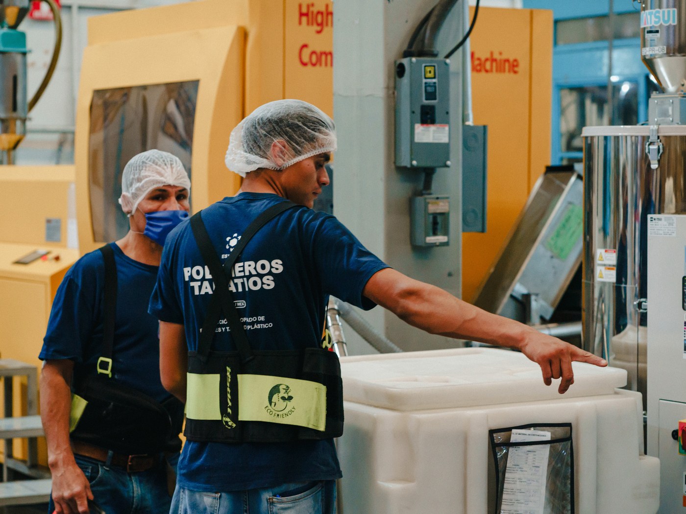 Two plant workers reviewing the process