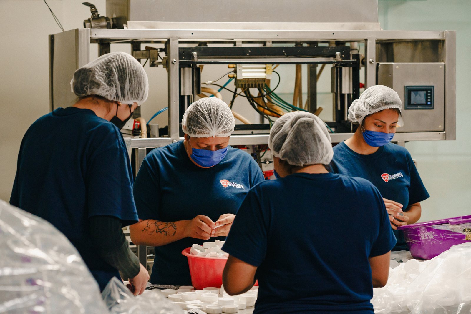 Line staff with hairnet and face mask